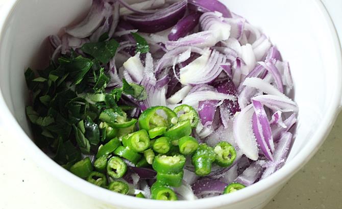 making dough for onion pakoda