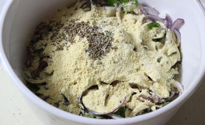 addition of flour to make stiff dough for onion pakoda