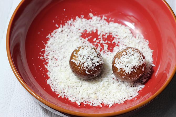 rolling balls in coconut to make dry gulab jamun