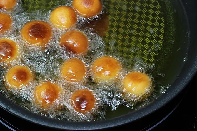 stirring often while frying gulab jamun
