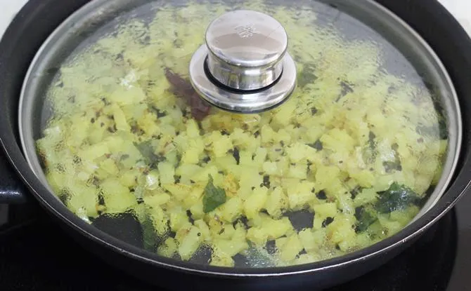 simmering aloo fry until the cubes are cooked