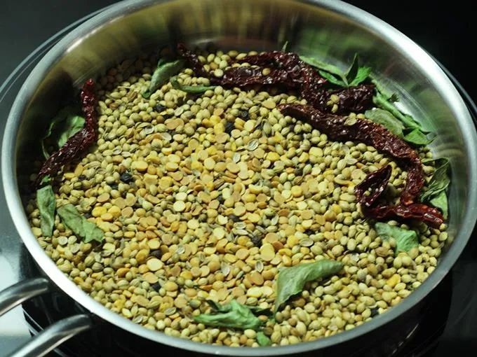 cooling roasted dals and spices to make rasam powder