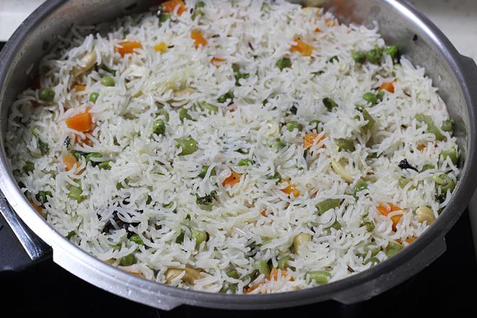 gently fluffing up the pulao