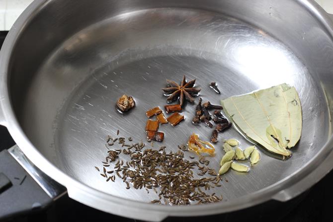 frying dry spices in oil for vegetable pualo recipe