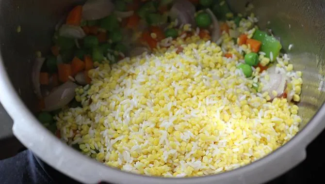addition of dal to pan for khichdi recipe for toddler