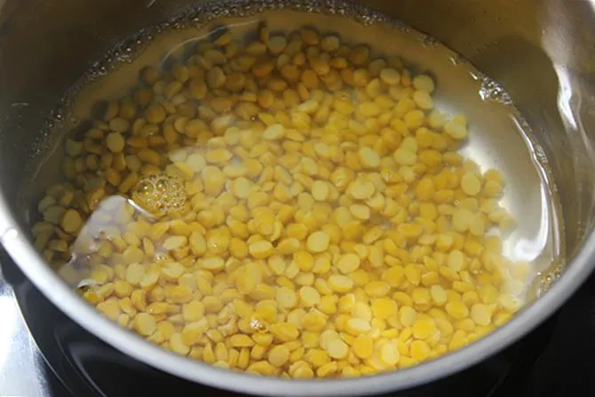 cooking dal for making poornam kudumulu recipe