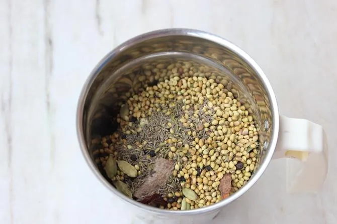 whole spices in a grinder