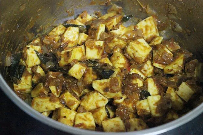 stirring to fry veggies for sweet potato curry