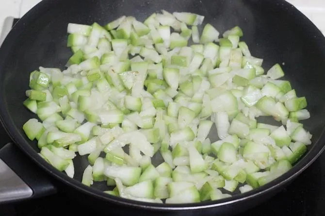frying chilies gourd in oil 