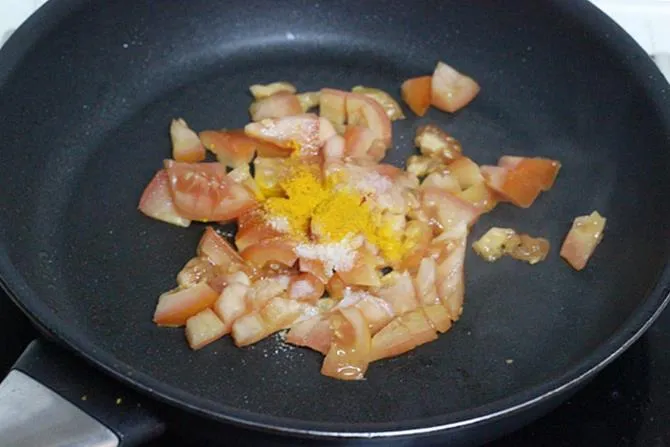 frying tomatoes until mushy to make sorakaya pachadi