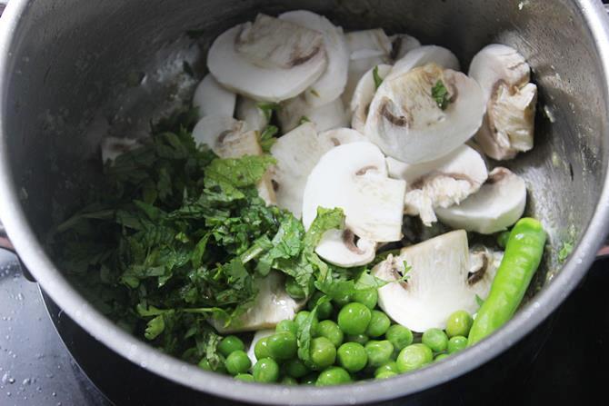 addition of peas pudina to pan for making mushroom biryani recipe