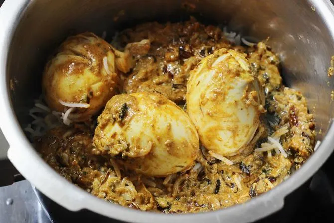 layering the gravy over rice