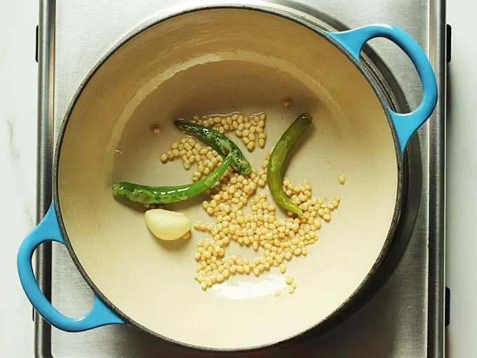 frying till dal turns golden to make peanut chutney