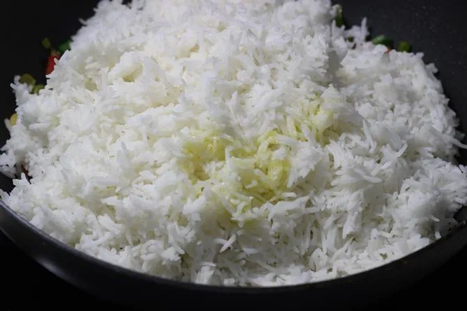 cooked and cooled rice added to the pan
