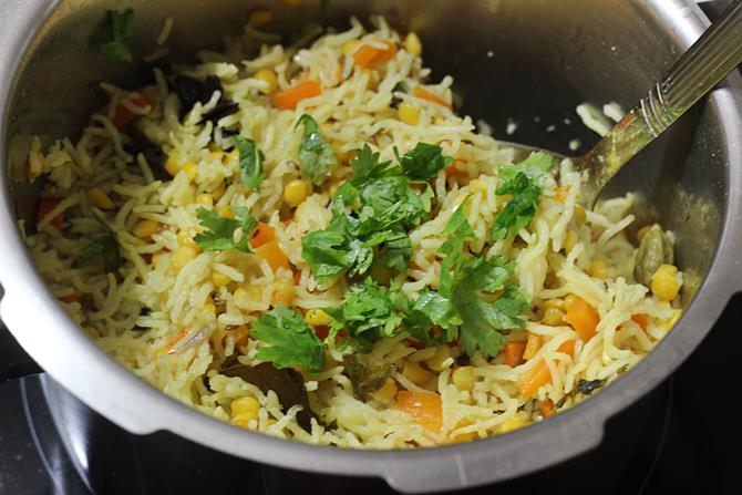 making chana dal pulao in a pressure cooker