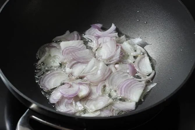 frying onions to make hyderabadi mirchi ka salan