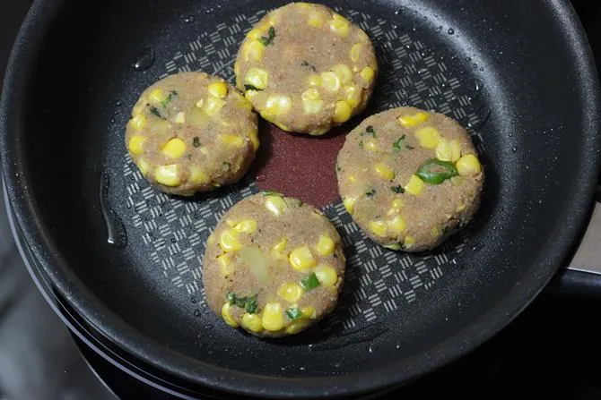 frying patties on pan