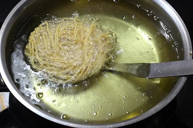 Dip the ladle in the hot oil