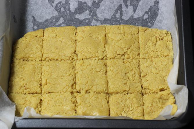 7 cups burfi mixture setting in tray