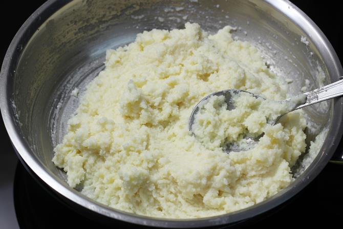 mixing the ingredients for nariyal barfi