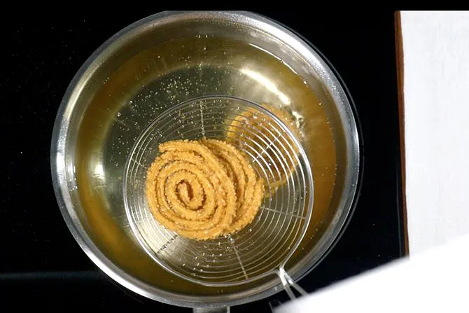 remove golden fried chakli to a cooling rack