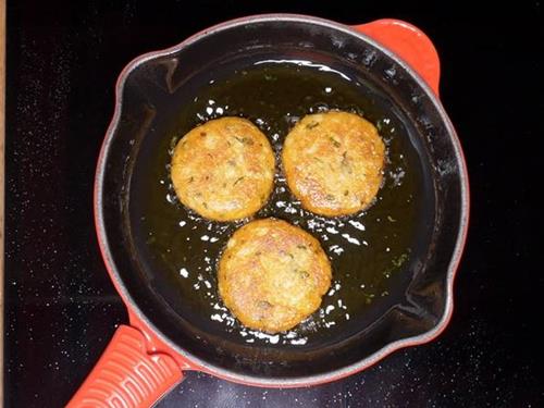 frying aloo tikki until crisp