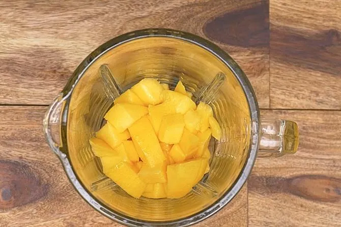 Add mango to a blender