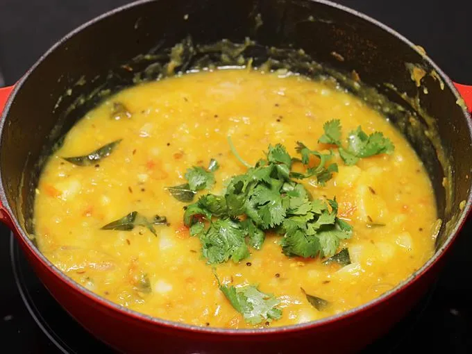 Adding chopped coriander leaves