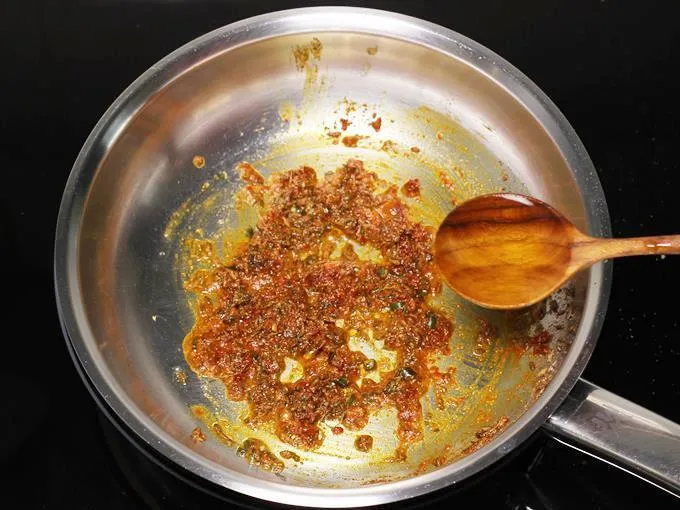 pouring water to make jeera aloo