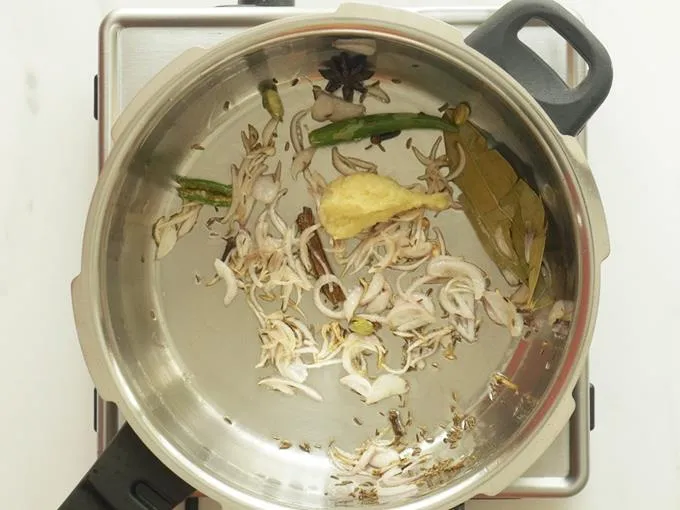 frying ginger garlic paste to make mushroom biryani