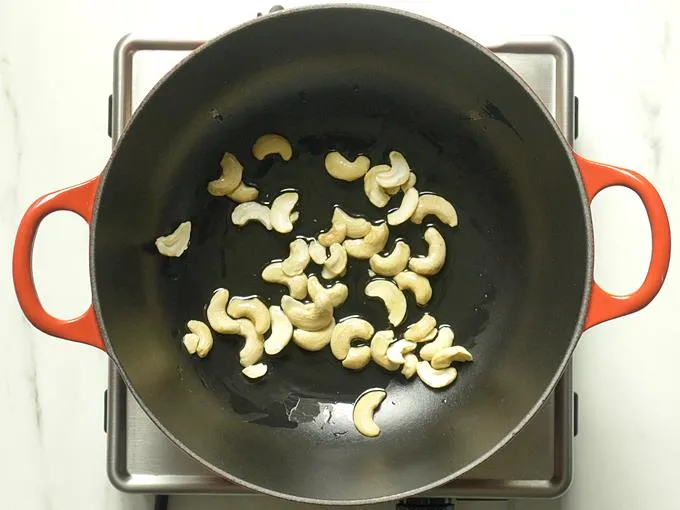 frying cashews till golden to make semiya payasam