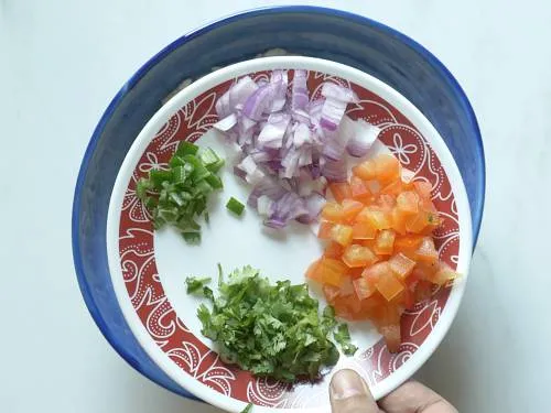 adding chopped veggies