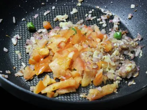 frying tomatoes for egg bhurji