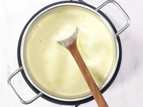 boiling milk in a pot