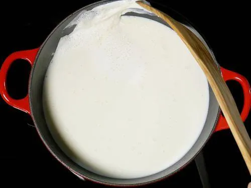 sticking cream to the sides to make rabri