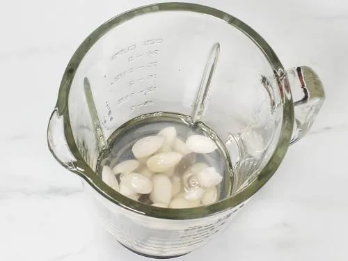 peeled almonds in a blender