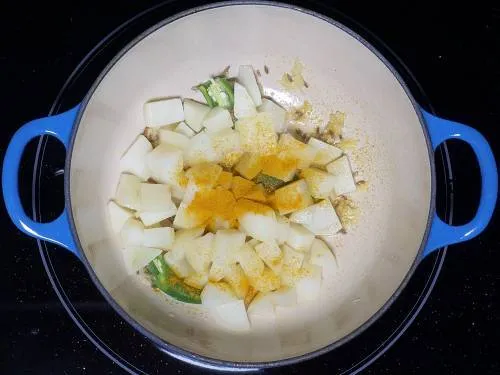 turmeric sprinkled over potatoes