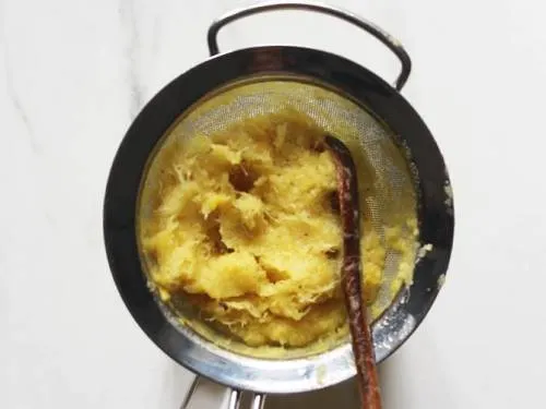 pineapple pulp in a strainer