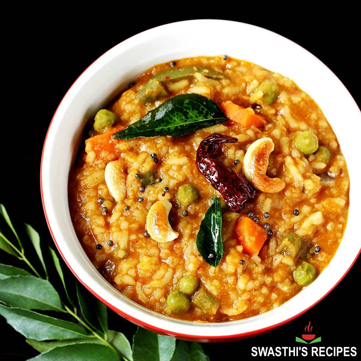 bisi bele bath served in a bowl with tempering