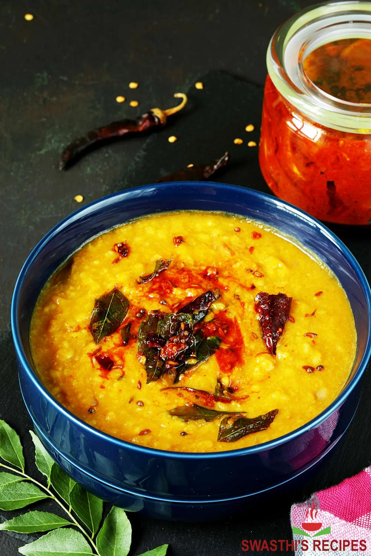 moong dal served in a blue bowl with tempering