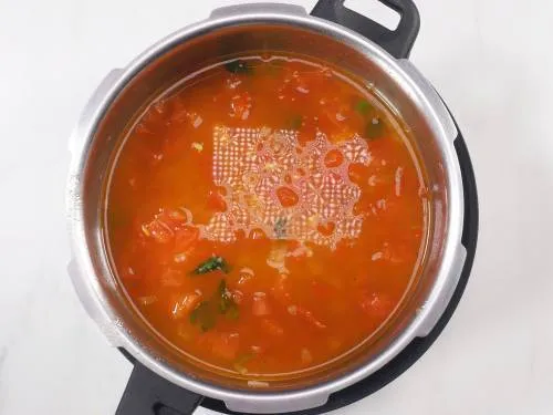 pouring water to cool moong dal