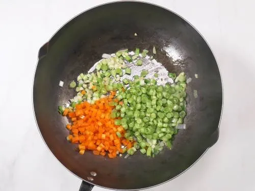 fry carrots, beans to make sweet corn soup