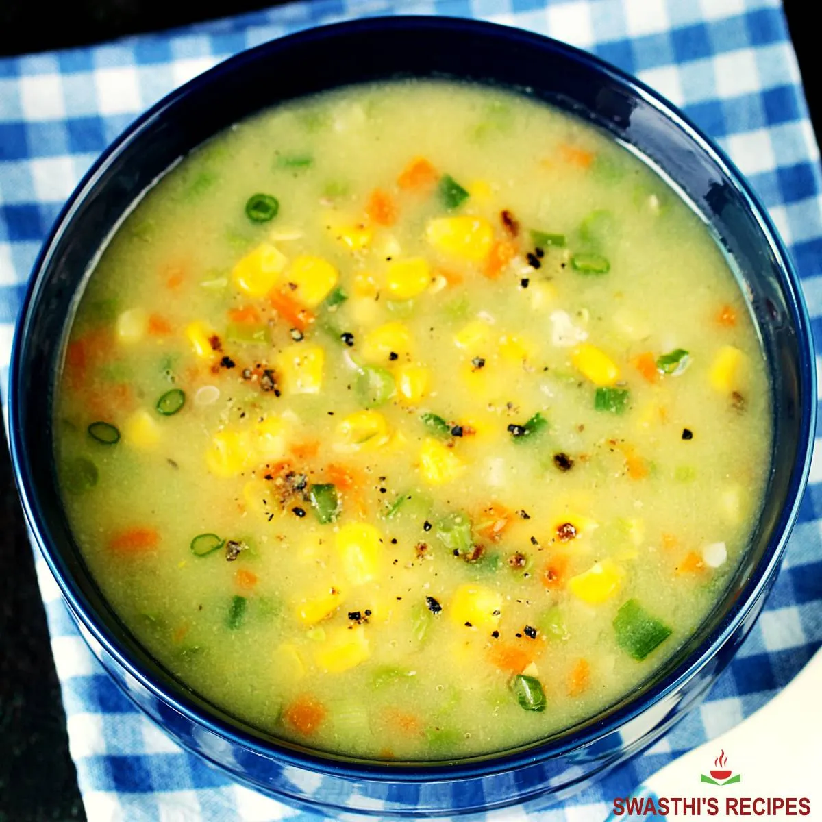 sweet corn soup in a blue bowl