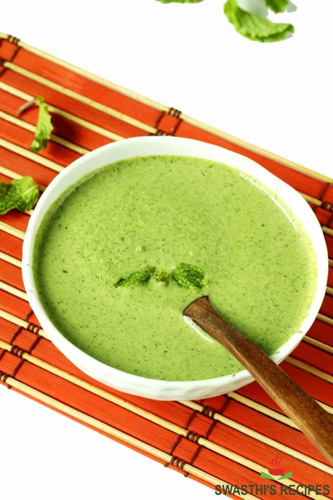 Pudina chutney also known as mint chutney served in a white bowl