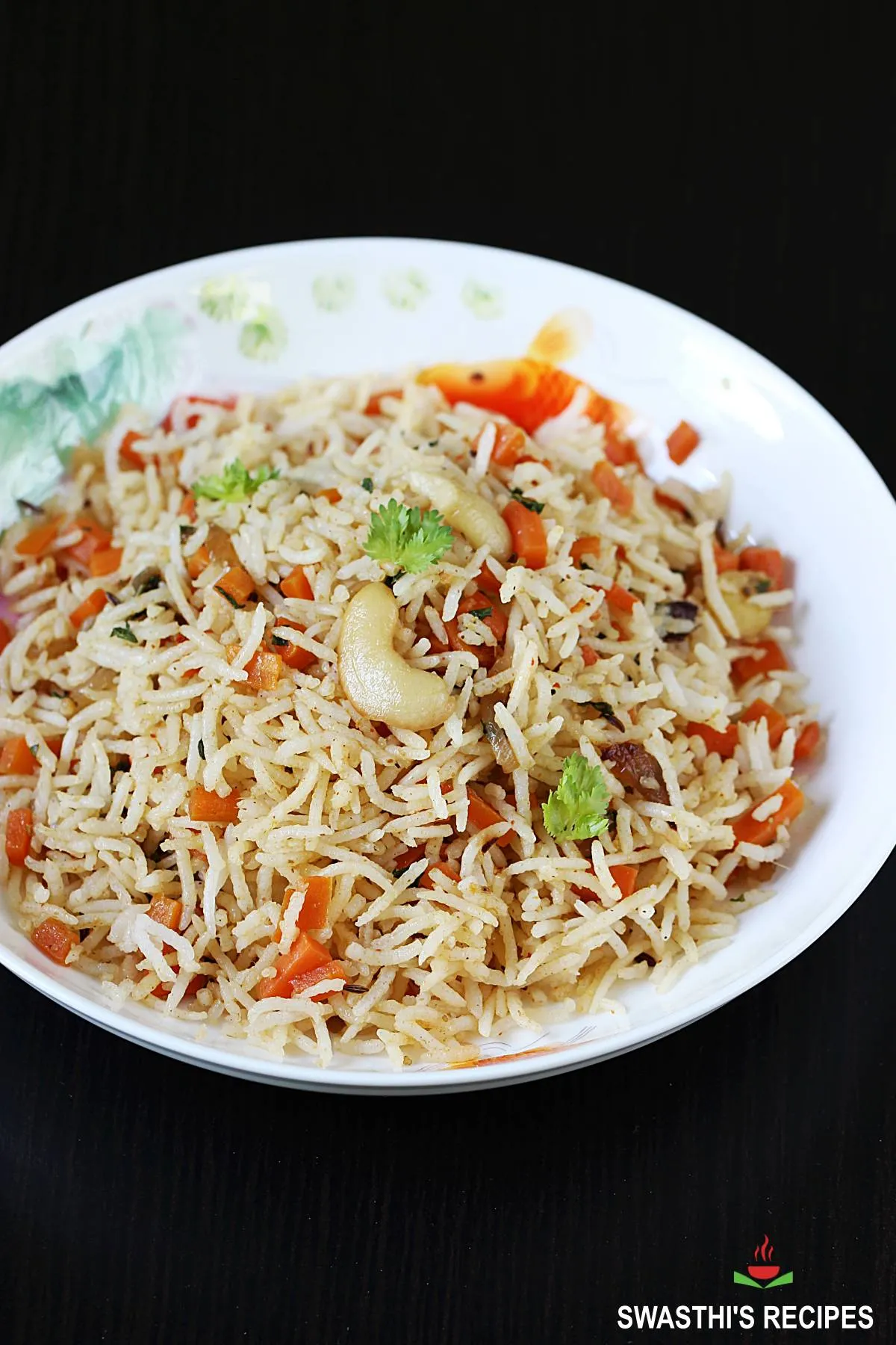 carrot rice recipe made with cooked rice, spices and fresh carrots