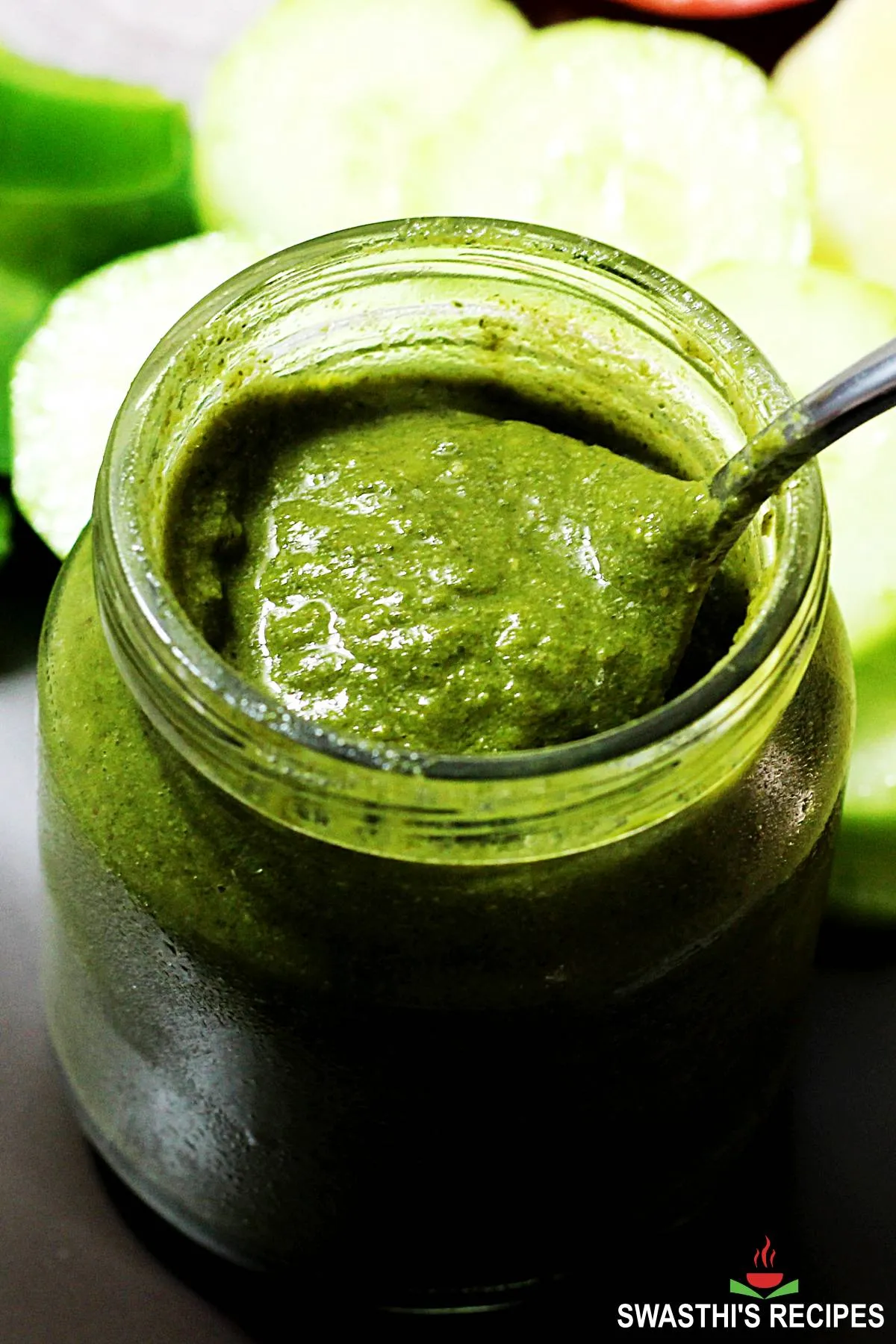 Green Chutney served in a glass bottle