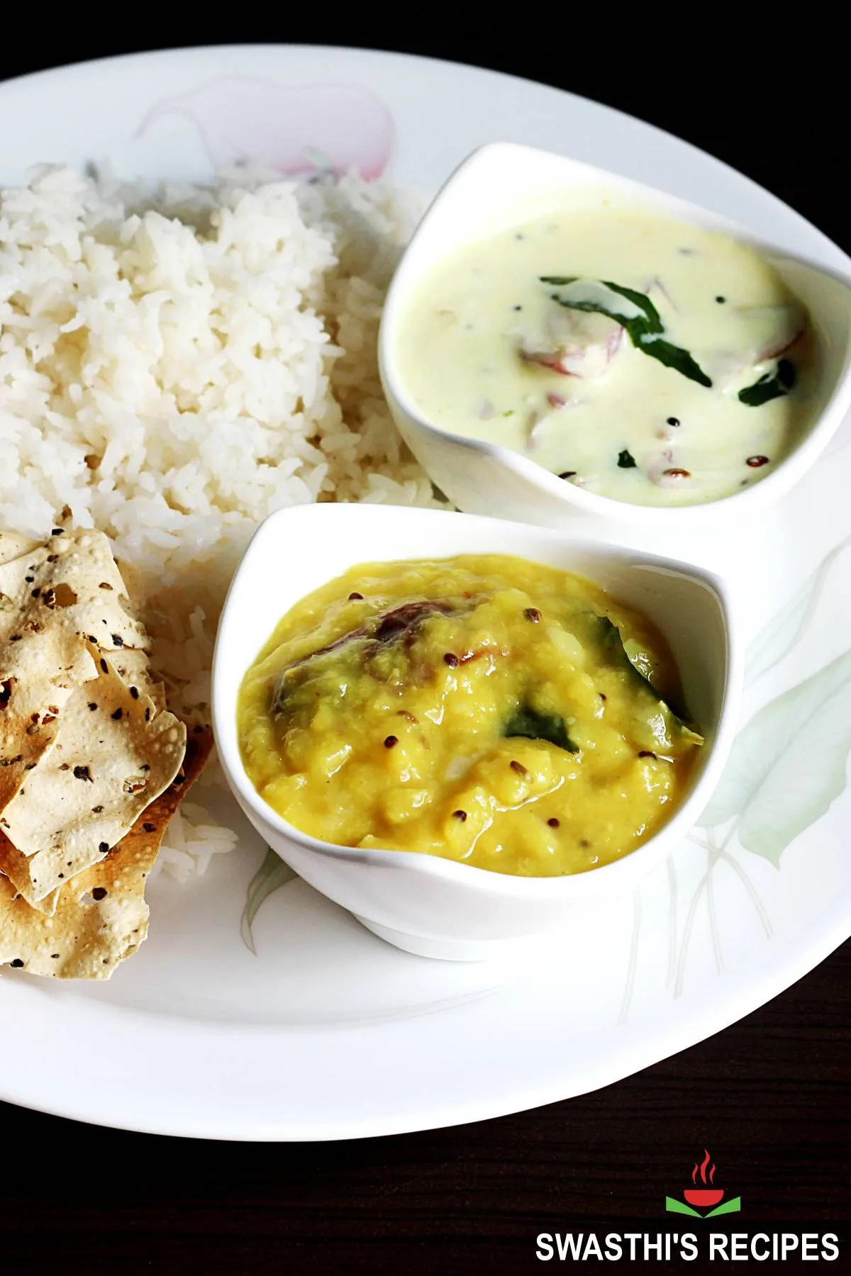 Mamidikaya pappu also known as mango dal served in a white bowl