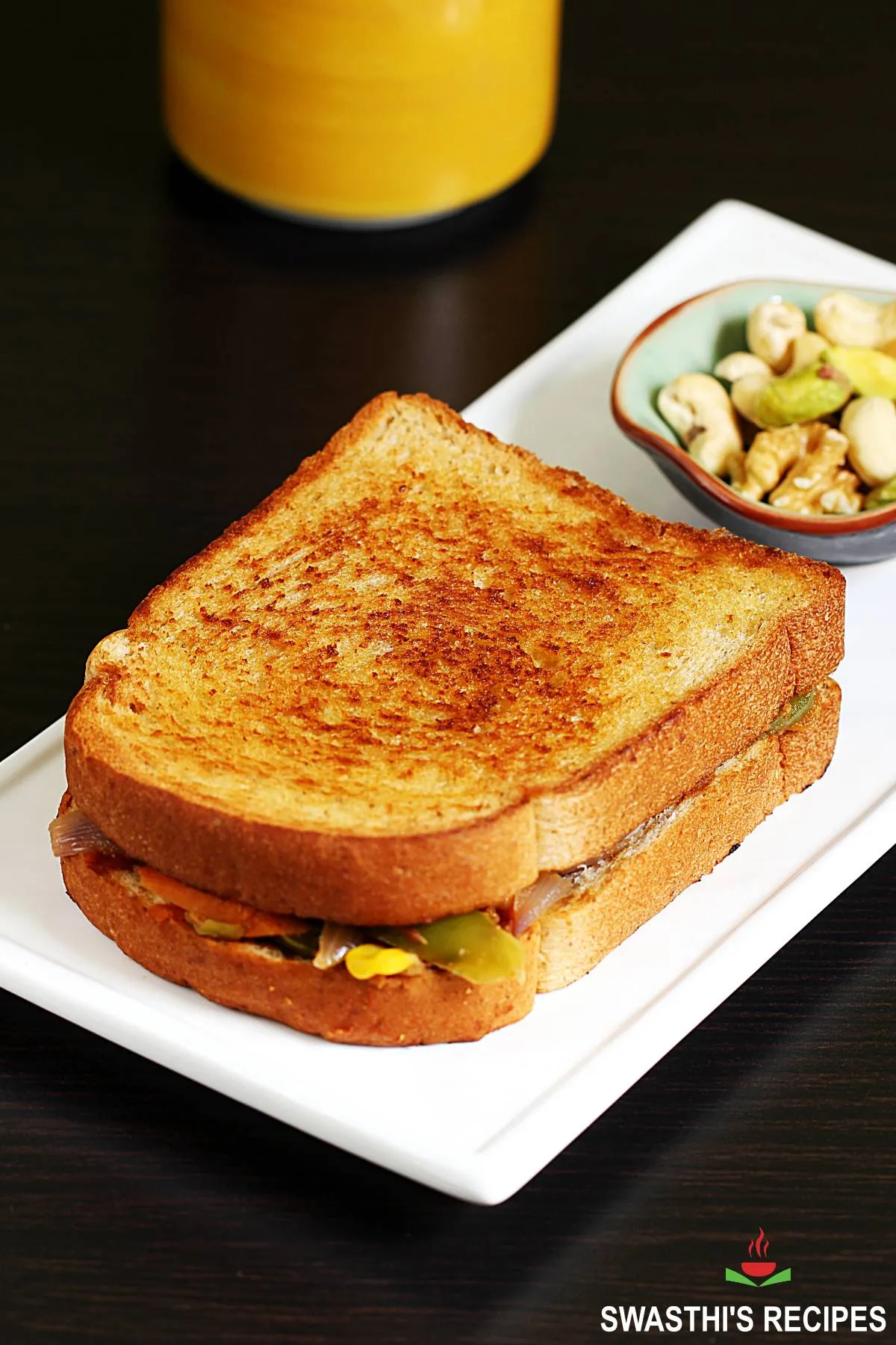 Veg sandwich also known as vegetable sandwich served in a white plate