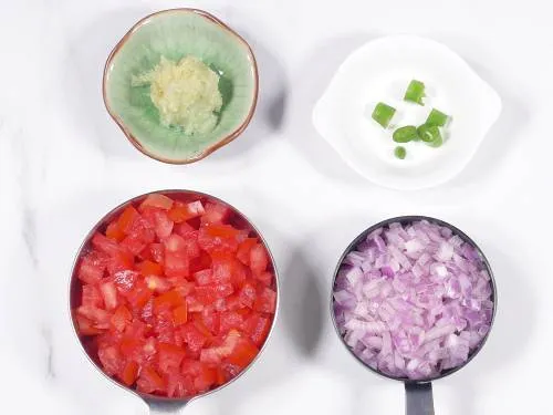 onions, tomatoes and chilies for curry