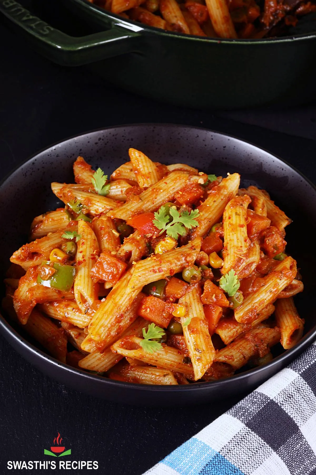 Masala Pasta served in a black bowl